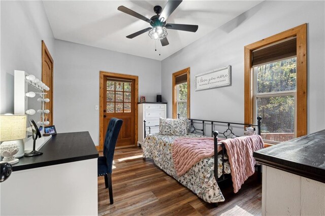 bedroom featuring ceiling fan and dark wood-type flooring