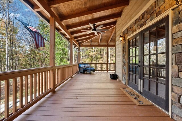 deck with french doors and ceiling fan