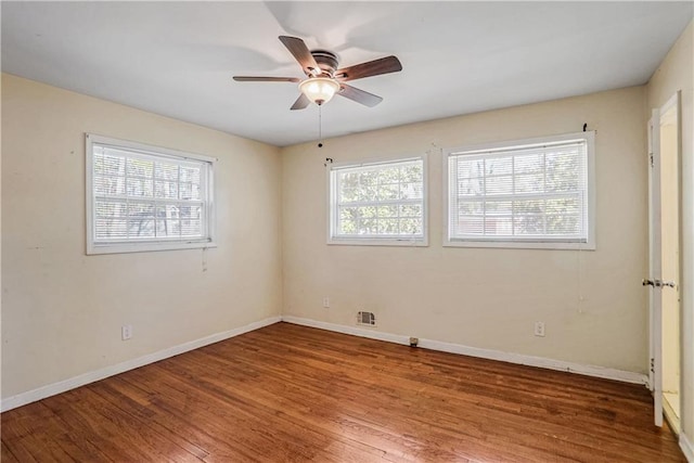 empty room with ceiling fan and wood-type flooring