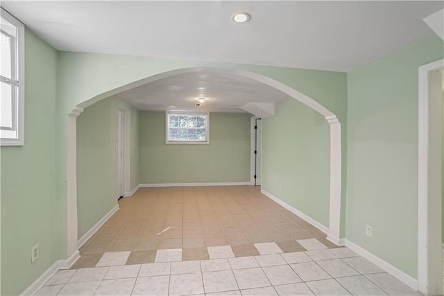 unfurnished room featuring light tile patterned floors