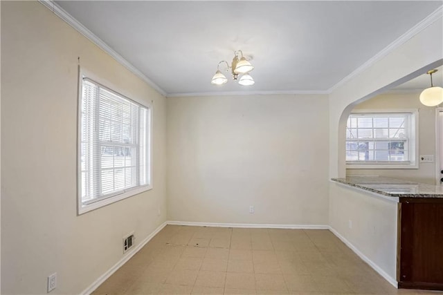 unfurnished dining area featuring ornamental molding and a chandelier