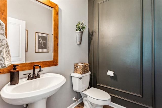 bathroom with a sink and toilet