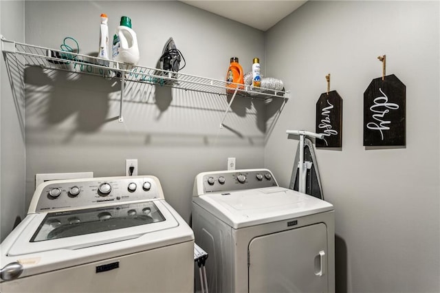 laundry area featuring independent washer and dryer and laundry area