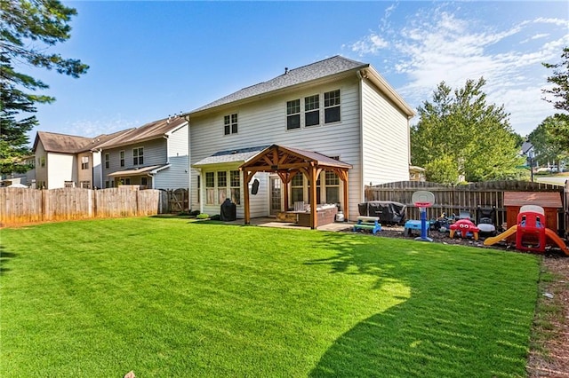 rear view of house featuring a fenced backyard, a patio area, a playground, a gazebo, and a yard