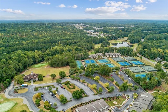 bird's eye view featuring a water view and a wooded view