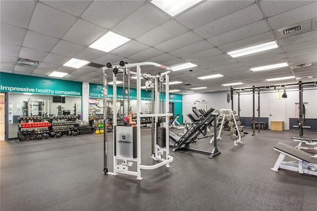 gym with visible vents and a drop ceiling