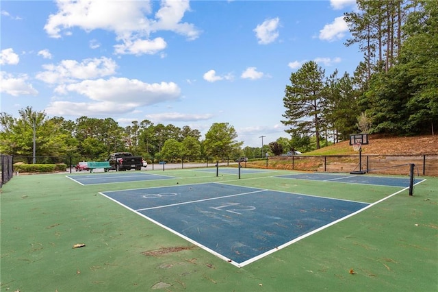 view of tennis court with fence
