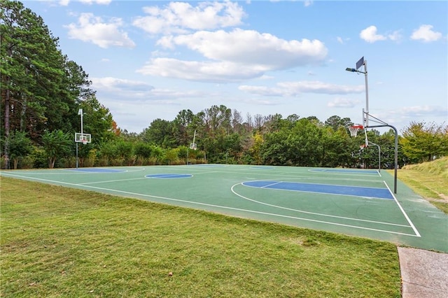view of sport court with a lawn and community basketball court