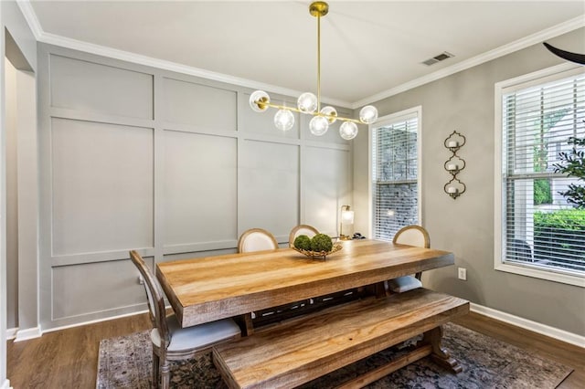 dining space featuring visible vents, ornamental molding, and dark wood-type flooring