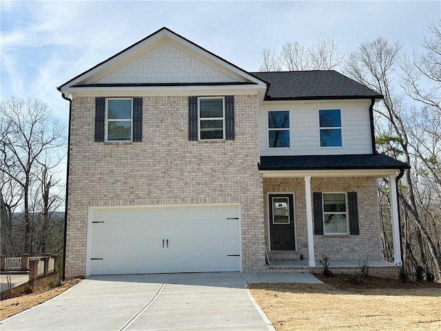 view of front of home featuring a garage, brick siding, covered porch, and driveway