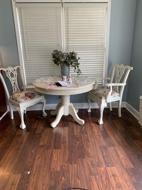 dining room featuring wood finished floors and baseboards