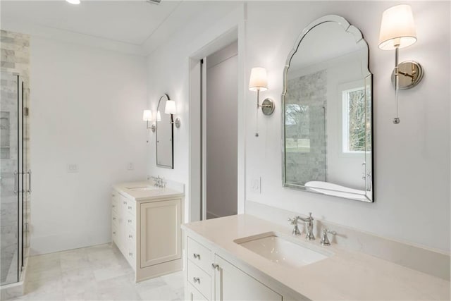 bathroom featuring a shower with shower door, vanity, and crown molding