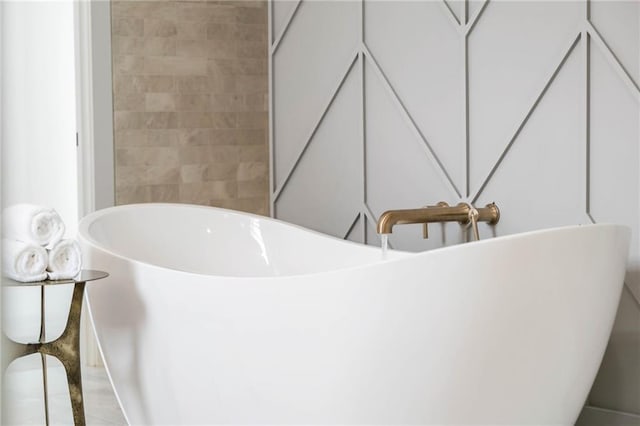 bathroom featuring a tub to relax in