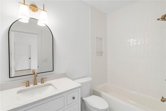 full bathroom with toilet, vanity, and tiled shower / bath combo