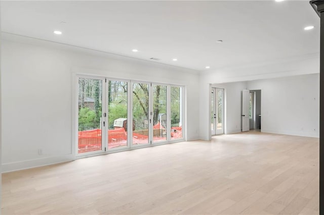 spare room featuring light hardwood / wood-style floors