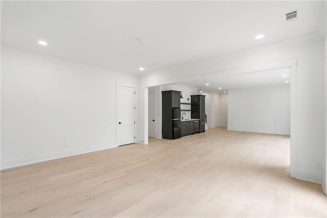 unfurnished living room featuring hardwood / wood-style floors