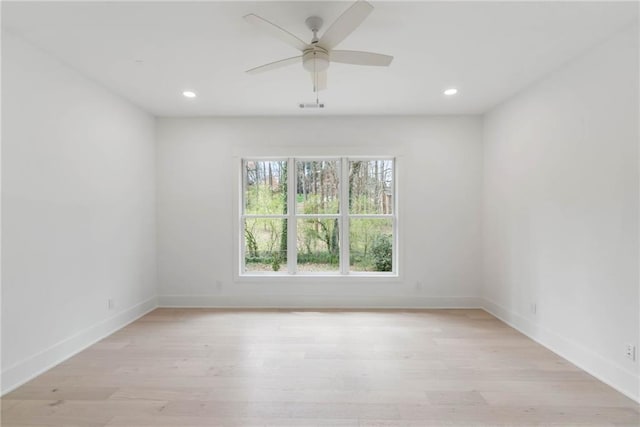 unfurnished room with ceiling fan and light hardwood / wood-style floors