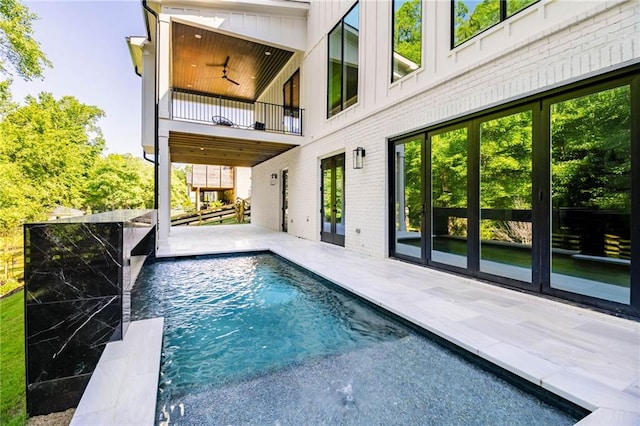 view of swimming pool with a patio area