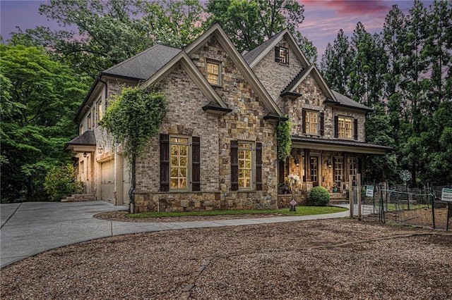 3809 Wieuca Rd NE, Atlanta, GA 30342 - view of front facade featuring a gate, stone siding, a porch, and driveway