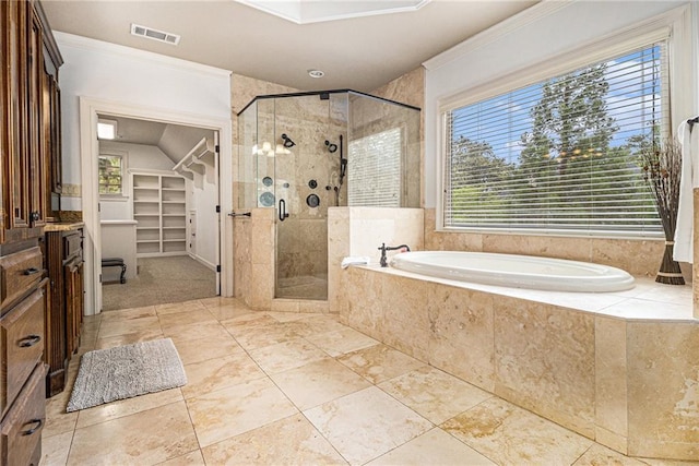 3809 Wieuca Rd NE, Atlanta, GA 30342 - full bathroom featuring ornamental molding, a bath, a stall shower, and a walk in closet