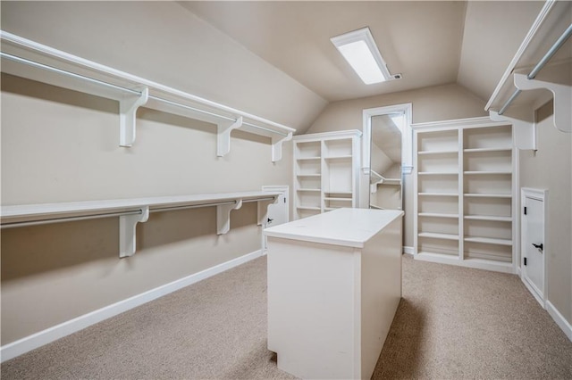 3809 Wieuca Rd NE, Atlanta, GA 30342 - walk in closet with light colored carpet and lofted ceiling