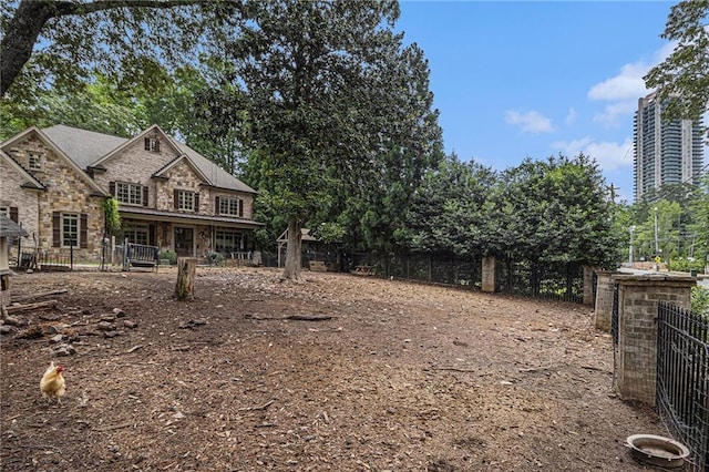 3809 Wieuca Rd NE, Atlanta, GA 30342 - view of front of house featuring stone siding and fence