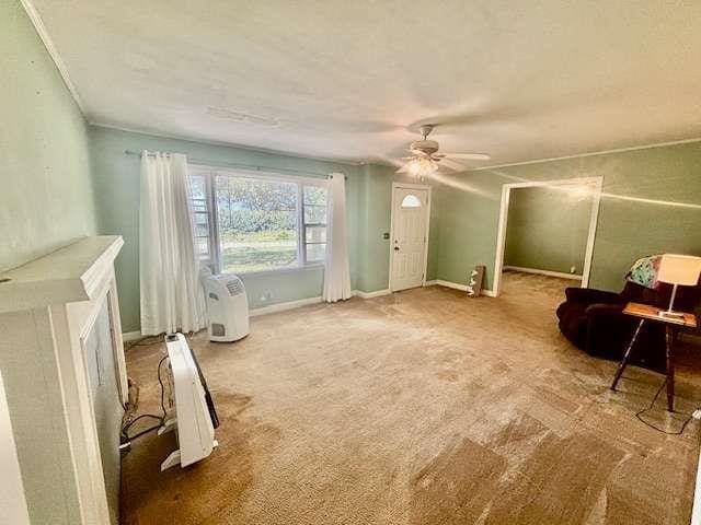 living area with carpet floors and ceiling fan