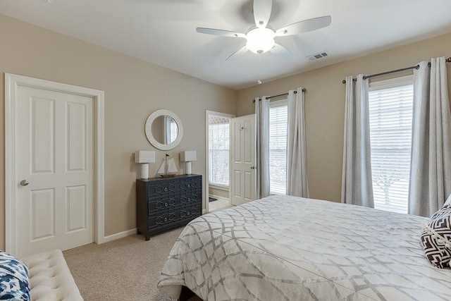 bedroom featuring carpet flooring, baseboards, visible vents, and a ceiling fan