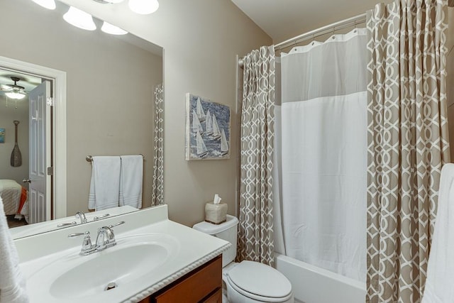 full bathroom with toilet, vanity, and shower / bath combo