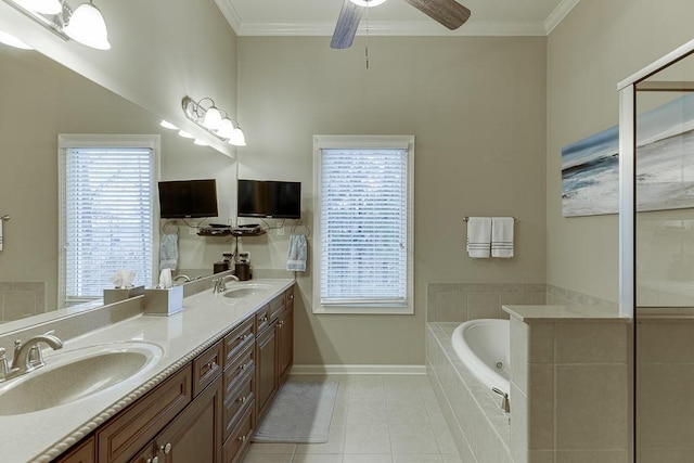 bathroom featuring tile patterned flooring, ornamental molding, and a sink