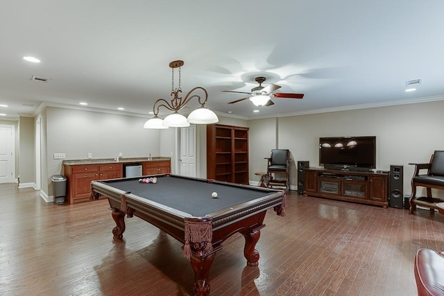 game room featuring visible vents, wood finished floors, and ornamental molding