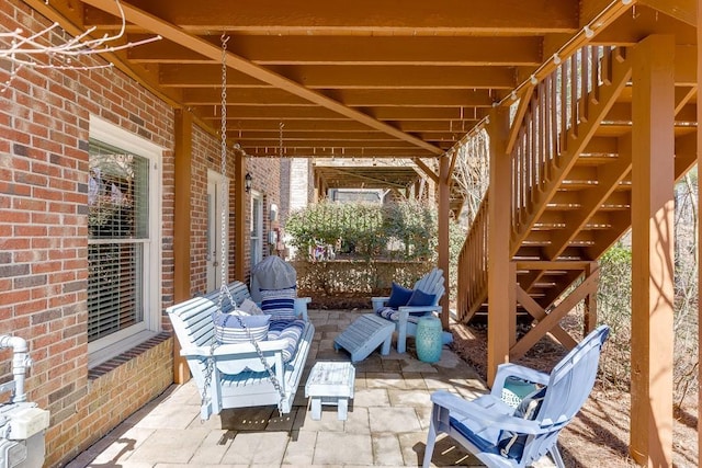 view of patio featuring stairway