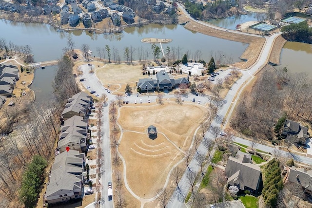 drone / aerial view featuring a residential view and a water view