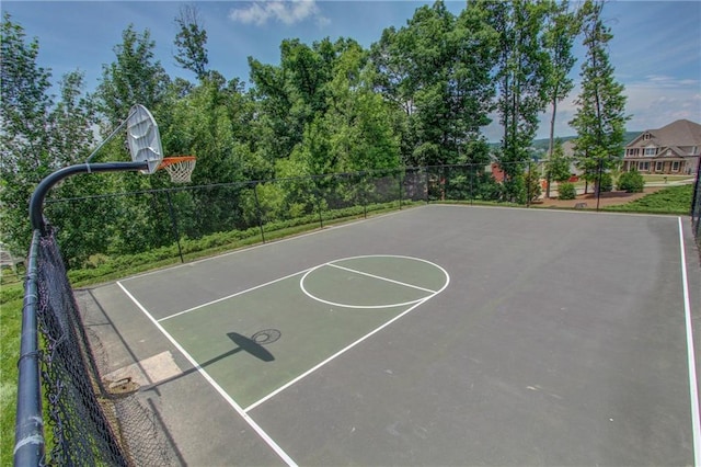 view of sport court with community basketball court and fence