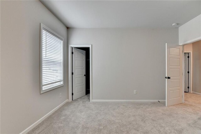1620 Branthaven Ln, Auburn, GA 30011 - unfurnished bedroom featuring multiple windows and light colored carpet