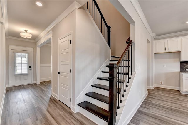 1620 Branthaven Ln, Auburn, GA 30011 - stairs featuring ornamental molding, wood finished floors, and recessed lighting