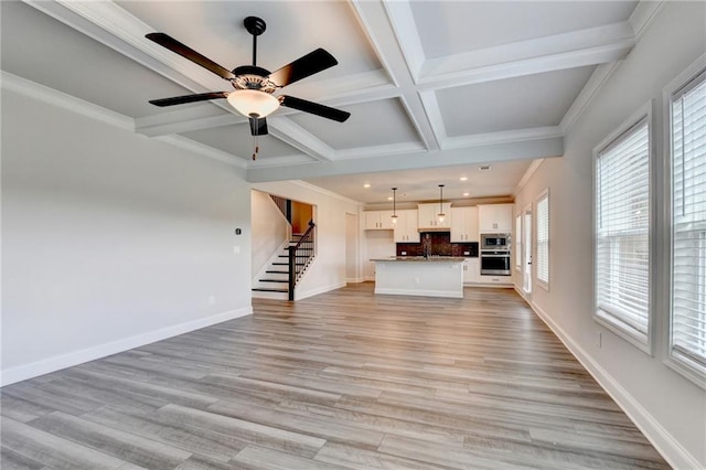 1620 Branthaven Ln, Auburn, GA 30011 - unfurnished living room featuring stairway, coffered ceiling, beamed ceiling, recessed lighting, and light wood-type flooring
