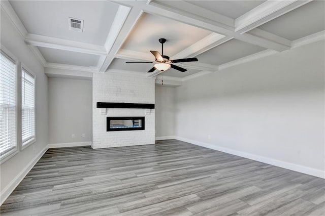 1620 Branthaven Ln, Auburn, GA 30011 - unfurnished living room featuring coffered ceiling, ceiling fan, wood finished floors, a brick fireplace, and beam ceiling