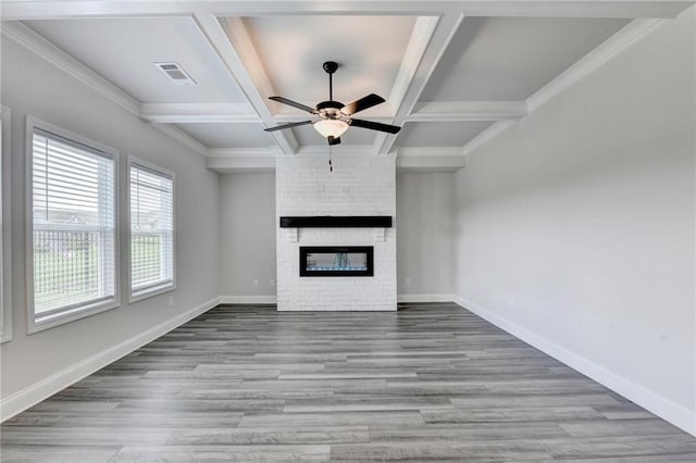 1620 Branthaven Ln, Auburn, GA 30011 - unfurnished living room featuring ceiling fan, coffered ceiling, a fireplace, wood finished floors, and beam ceiling