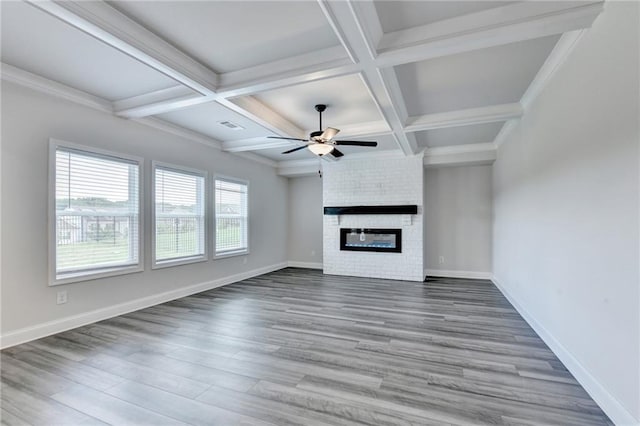1620 Branthaven Ln, Auburn, GA 30011 - unfurnished living room with ceiling fan, coffered ceiling, wood finished floors, beamed ceiling, and a fireplace