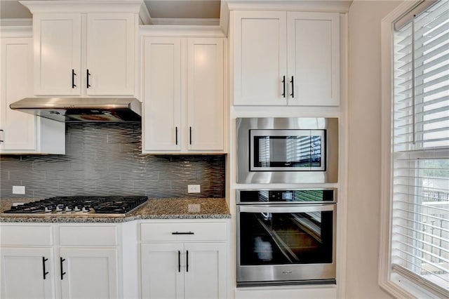 1620 Branthaven Ln, Auburn, GA 30011 - kitchen with stainless steel appliances, under cabinet range hood, and white cabinets
