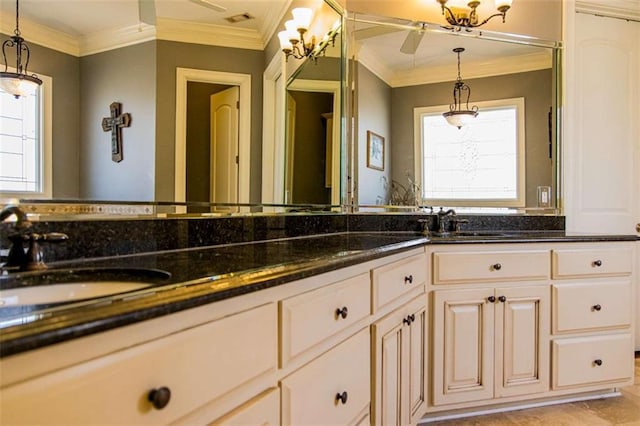 bathroom featuring double vanity, a sink, and crown molding