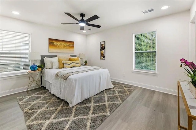 bedroom featuring dark hardwood / wood-style floors and ceiling fan