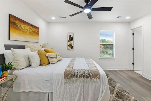 bedroom featuring hardwood / wood-style floors and ceiling fan