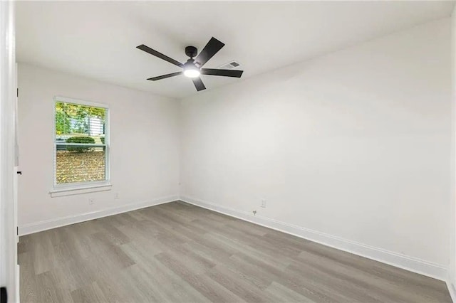 spare room with ceiling fan and light hardwood / wood-style floors