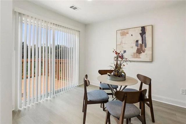 dining space featuring hardwood / wood-style floors