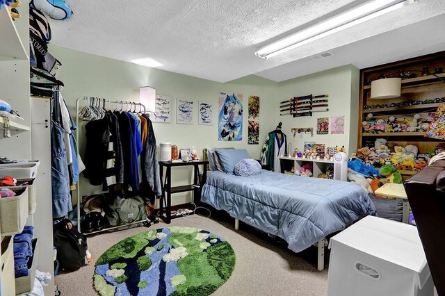 3491 Birchwood Trl, Snellville, GA 30078 - carpeted bedroom with a textured ceiling