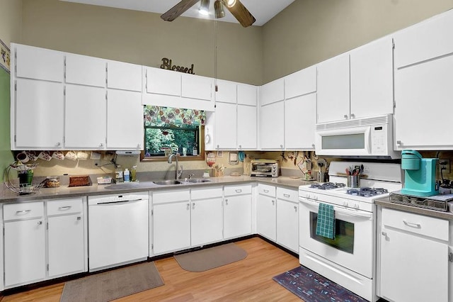 3491 Birchwood Trl, Snellville, GA 30078 - kitchen featuring white appliances, a ceiling fan, light wood-style flooring, and white cabinetry