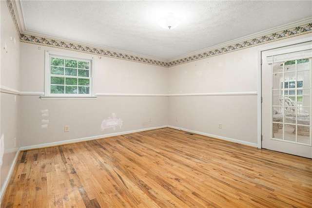 5247 Yeager Rd, Douglasville, GA 30135 - spare room with wood-type flooring, baseboards, ornamental molding, and a textured ceiling