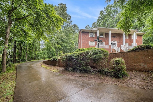 5247 Yeager Rd, Douglasville, GA 30135 - view of front of property with brick siding, a porch, and stairs